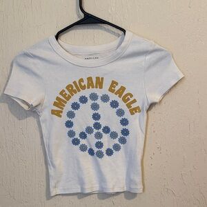 American Eagle Outfitters White Crop Top with Blue and Gold Design